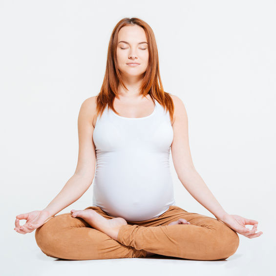 Pregnant woman participating in a Pregnancy Yoga class